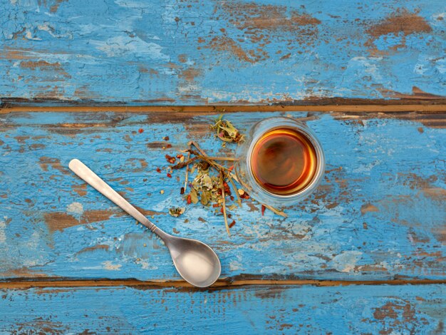 Photo herbal tea on a blue table - top view