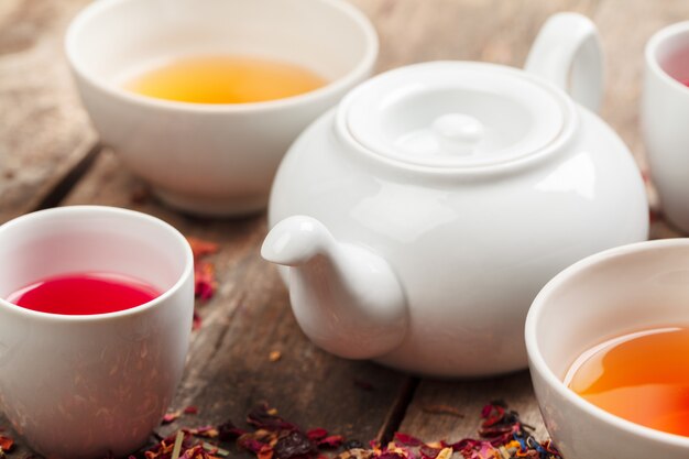 Herbal tea in cups on a wooden background