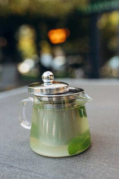 Herbal tea in a transparent teapot