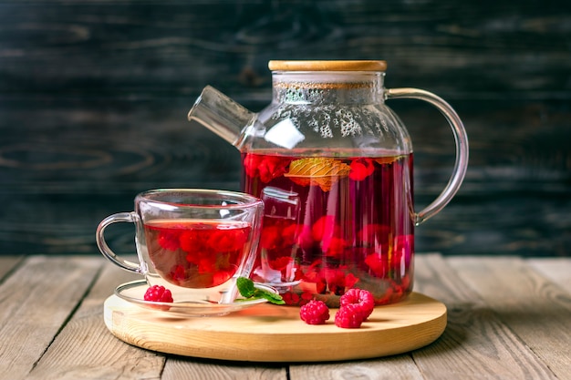 Herbal tea with berries raspberries mint leaves and hibiscus flowers