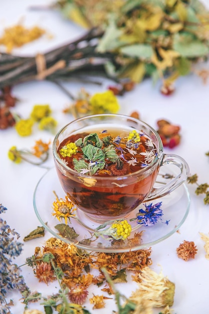 Herbal tea with medicinal herbs and flowers Selective focus