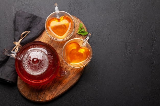 Herbal tea with mint and lemon Tea cup and teapot