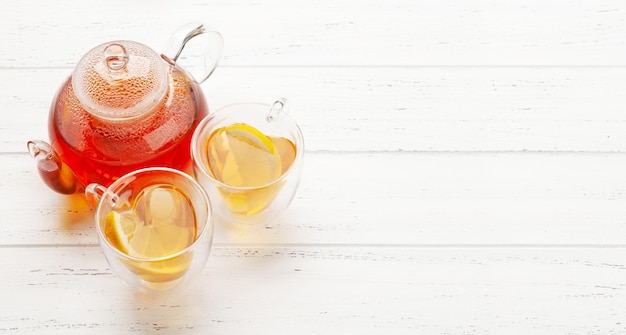 Herbal tea with mint and lemon Tea cup and teapot