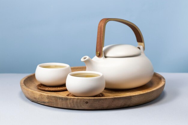 Herbal tea with two white tea cups and teapot Tea concept