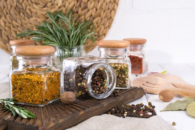  herbs, colorful dry spices in glass jars