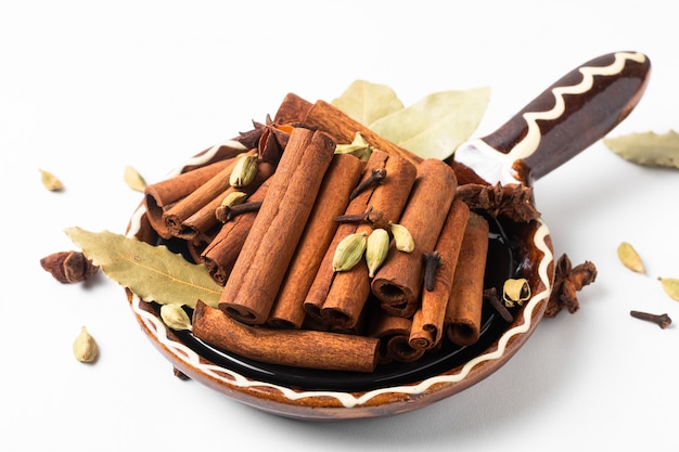 Herbs and spices in brown handle ceramic bowl