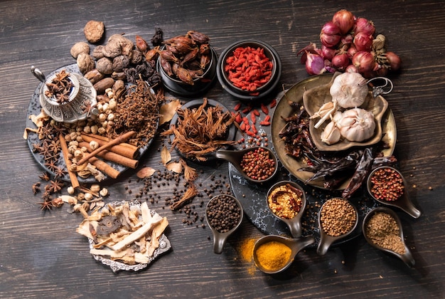 Herbs and spices for cooking Indian spices on black slate backgroundTop view