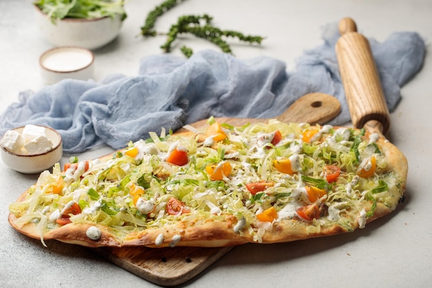 Herbs Vegetable Pizza served in dish isolated on table top view of arabian food