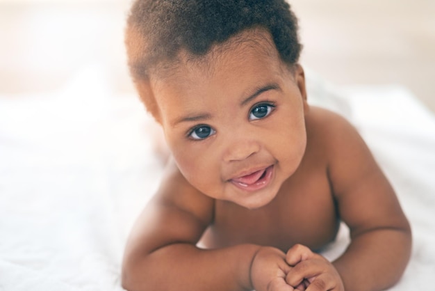 Here comes the cuteness Shot of an adorable baby girl at home