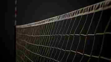 Photo here is a description for the image this image shows a volleyball net in a dark background