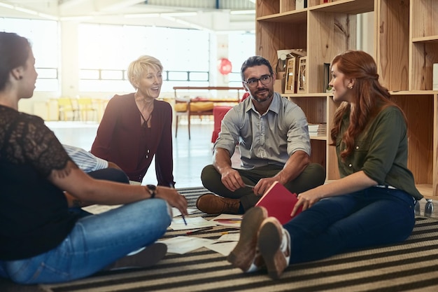 Here we can share ideas on a respectful level. Cropped shot of a group of business colleagues in the office sitting on the floor and discussing ideas.