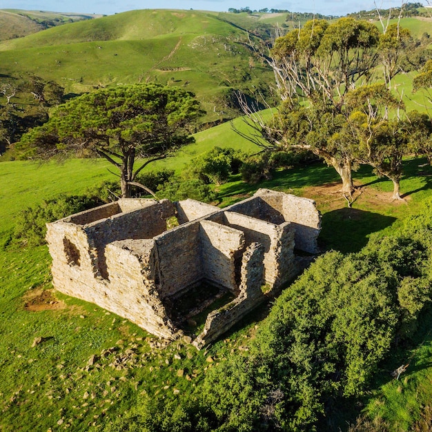 Heritage house in a green field by drone