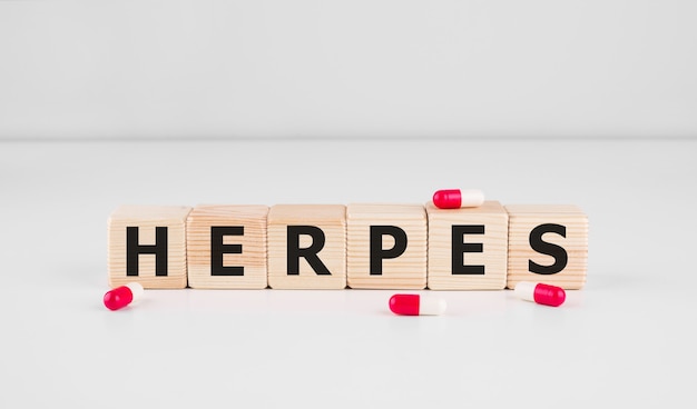 Herpes - word from wooden blocks with letters, viral diseases herpes viruses concept,