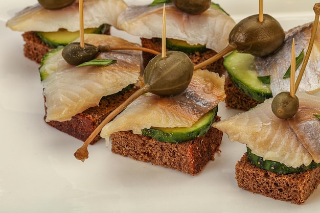 Herring fillet canape with caperberry