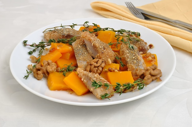 Herring in the pumpkin gratin with nut sauce