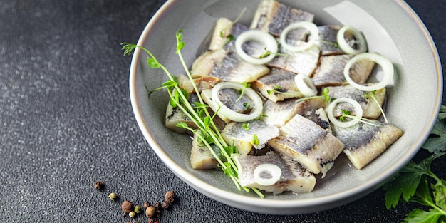 Herring salted piece plate seafood fish meal food snack on the table copy space food