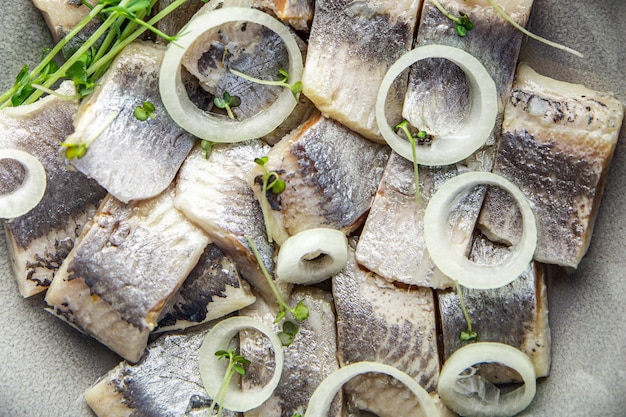 herring slice pieces of fish with onion seafood healthy meal food snack on the table food