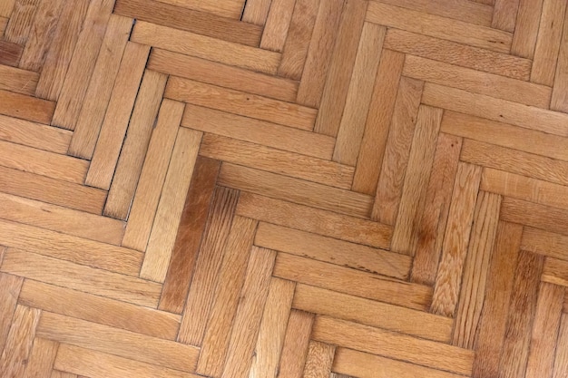 Herringbone pattern parquet wood floor texture wooden oak\
flooring background overhead