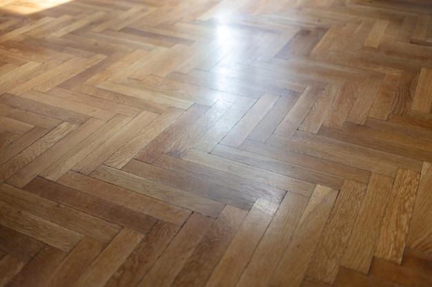 Herringbone pattern parquet wood floor texture wooden oak\
flooring background overhead