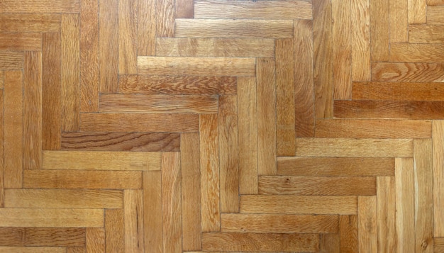 Herringbone pattern parquet wood floor texture wooden oak\
flooring background overhead