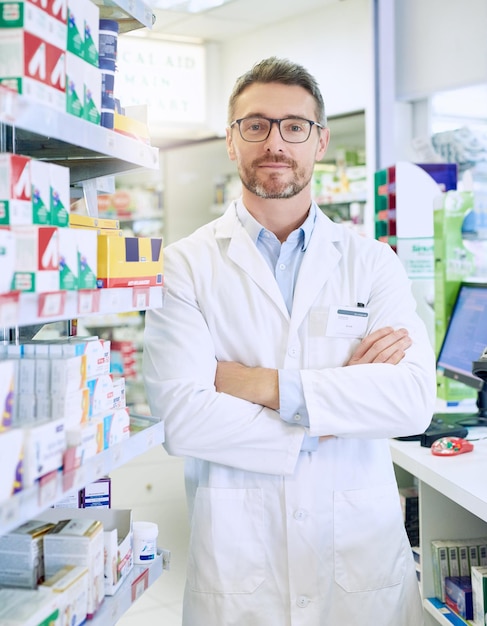 Hes equipped with the necessary skills to to improve your health Portrait of a confident mature pharmacist working in a pharmacy