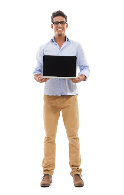 Hes got a new laptop for you Full body portrait of a handsome young man happily displaying a laptop