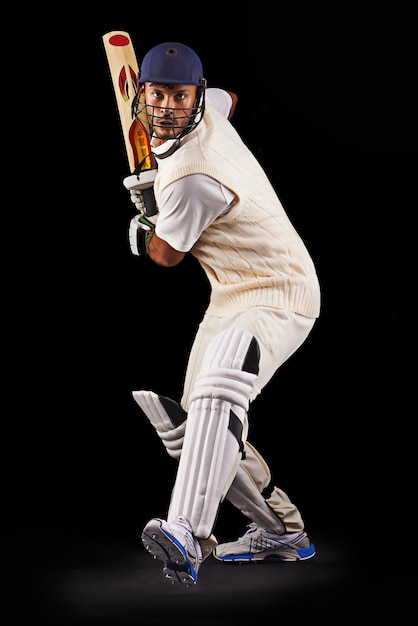 Hes got some talent with the bat A cropped shot of an ethnic young man in cricket attire isolated on black