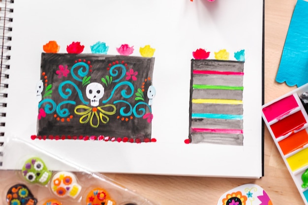 Het ontwerpen van zes lagen chocoladetaart voor Dia de los Muertos vakantie.