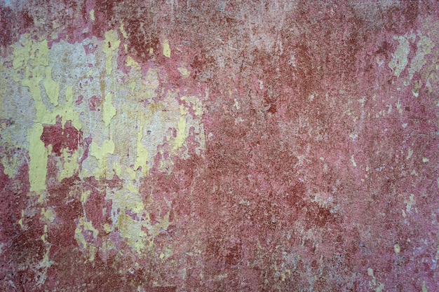 Het patroon van een oude, betonnen, gepleisterde roestige muur