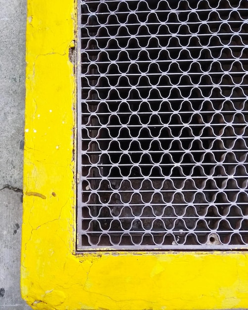 Hexagon metal grid in yellow frame