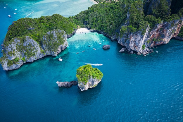 Hi season boat and tourists on phiphi island Krabi Thailand aerial view from drone 