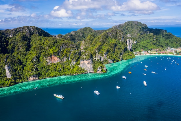 Hi season boat and tourists on phiphi island Krabi Thailand aerial view from drone 