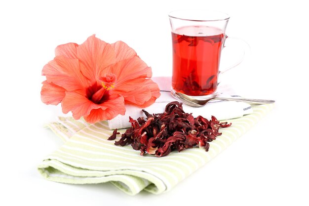 Hibiscus tea and flower on color napkin isolated on white