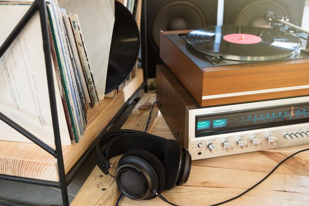 HiFi system with turntable amplifier headphones and lp vinyl records in a listening room