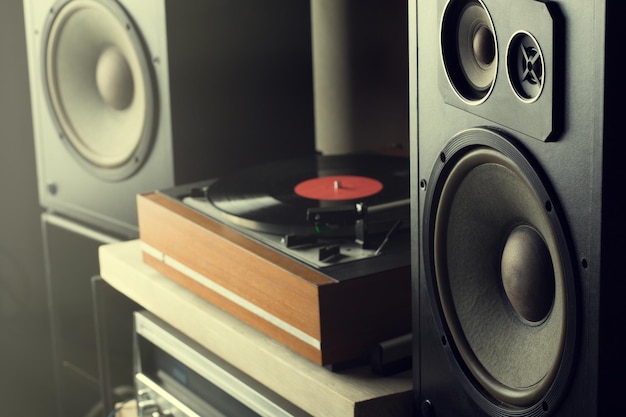 Photo hifi system with turntable amplifier headphones and lp vinyl records in a listening room