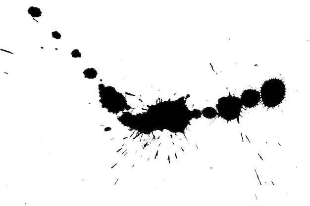 high angel view of black ink spots on paper
