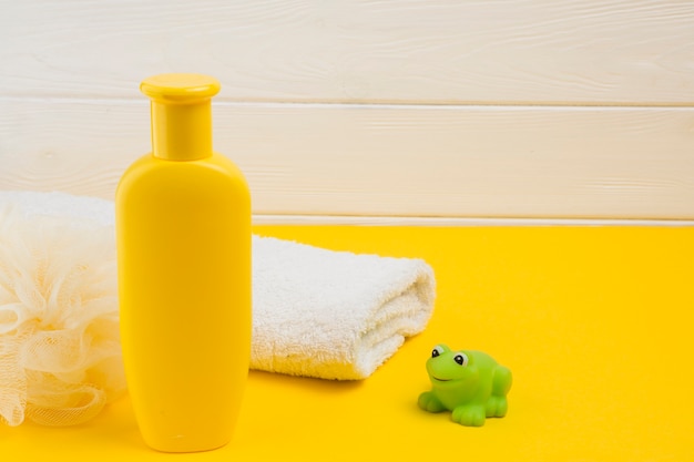 Photo high angle of bottle and towel for baby shower