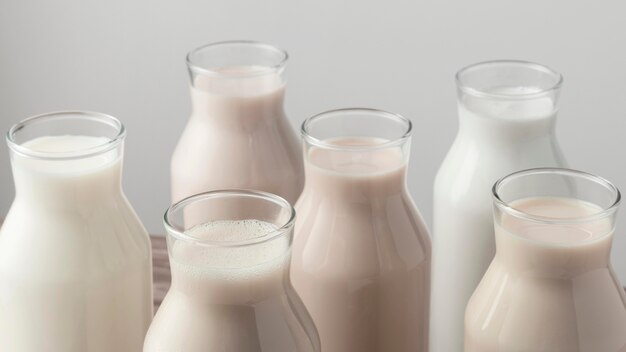 Photo high angle of bottles with variety of milk types