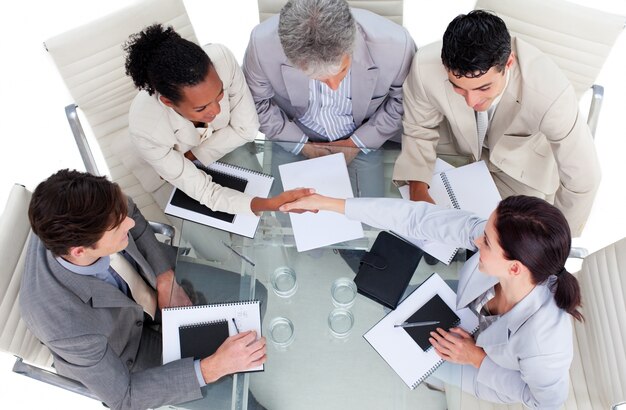 High angle of business people shaking hands