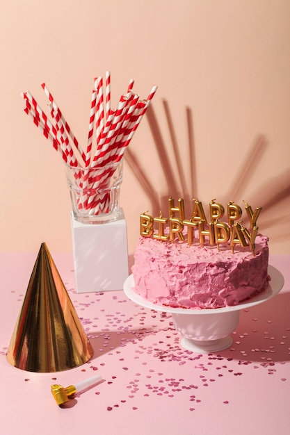 Photo high angle cake and birthday candles assortment