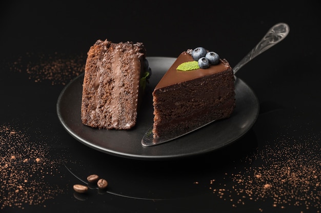 High angle of chocolate cake slices on plate with spatula