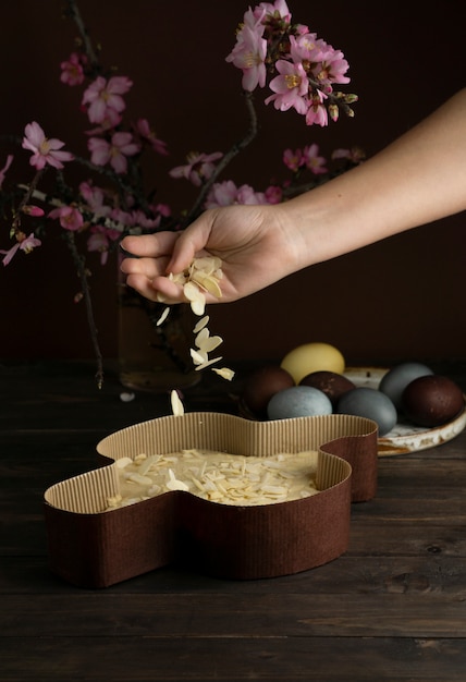 Photo high angle colomba dough and pink flowers