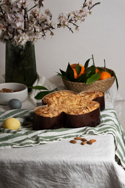 High angle delicious colomba and tangerines on table