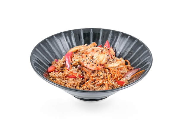 High angle of delicious served dish of fried rice with shrimps and vegetables topped with sesame seeds