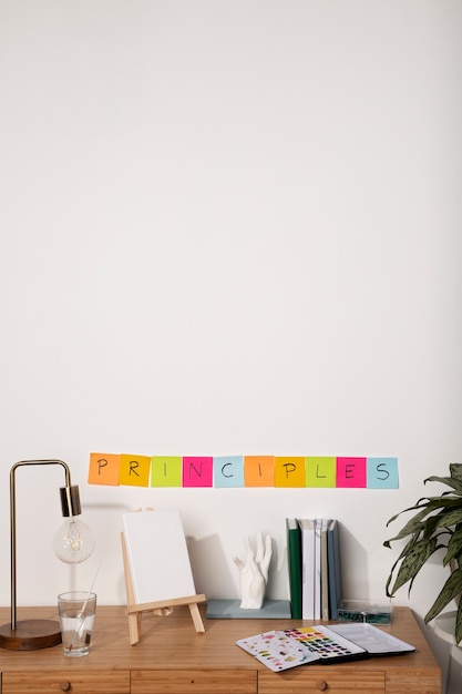 High angle desk arrangement with colorful post its