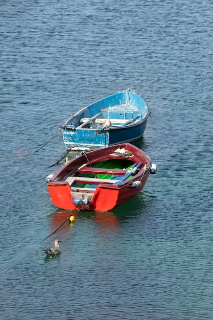 High angle different colored boats on the water