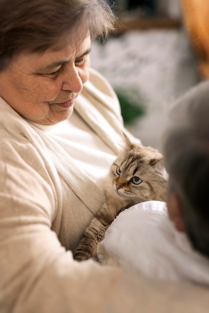 high angle elderly people with cat