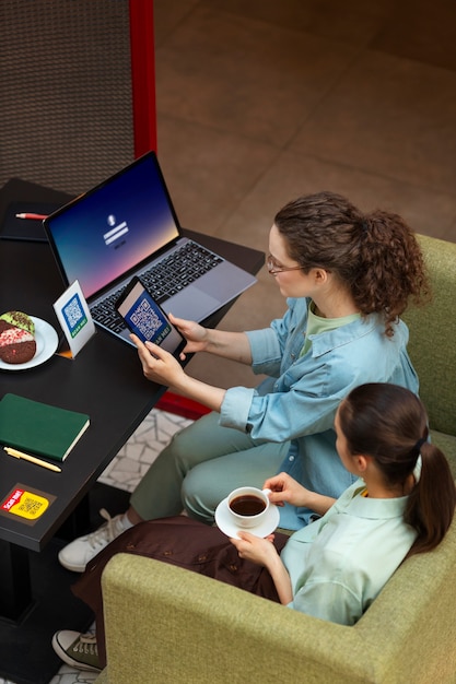 High angle friends reading menu in restaurant