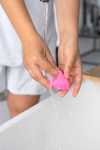 High angle hands washing menstrual cup