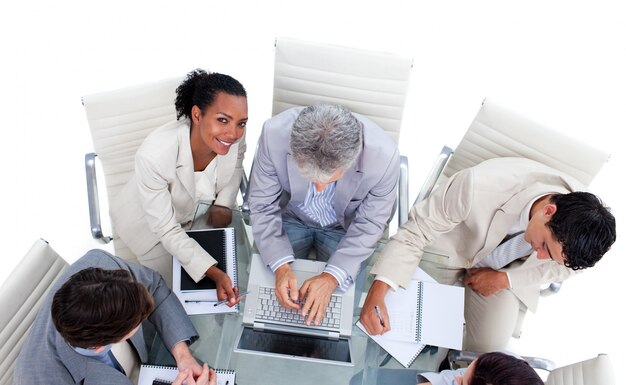 High angle of international business people using a laptop